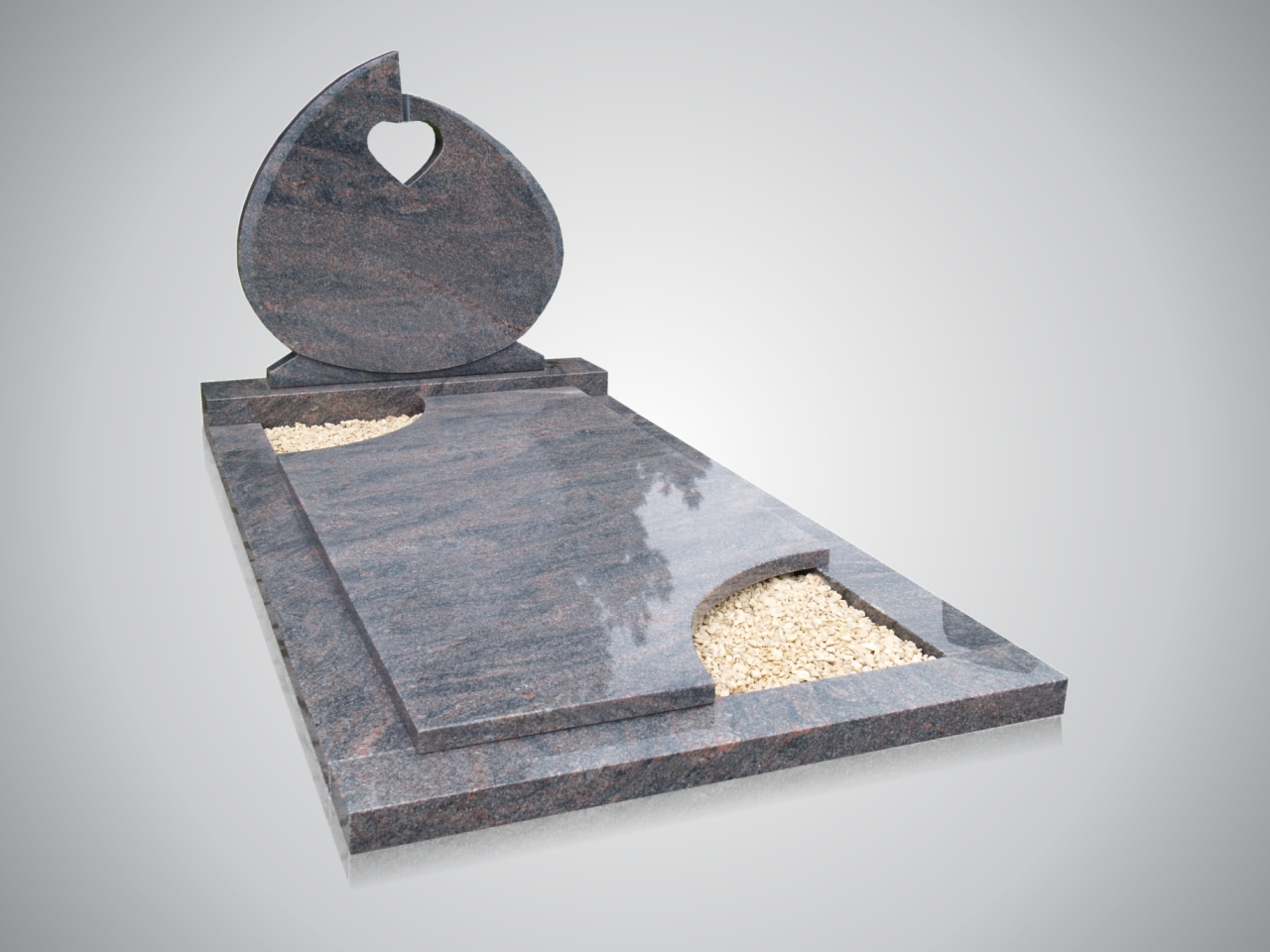 Modern grafmonument met traanvorm en hartuitsnijding, geplaatst op begraafplaats in Zoetermeer